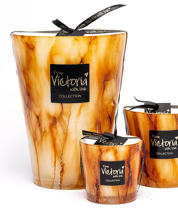Set of three Victoria With Love candles in marbled amber glass.